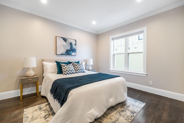 bedroom featuring ornamental molding and dark wood-type flooring