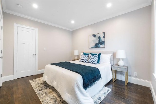 bedroom with ornamental molding and dark wood-type flooring