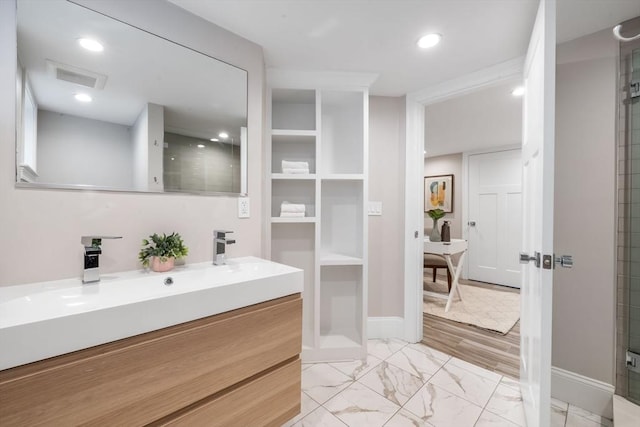 bathroom with vanity and walk in shower