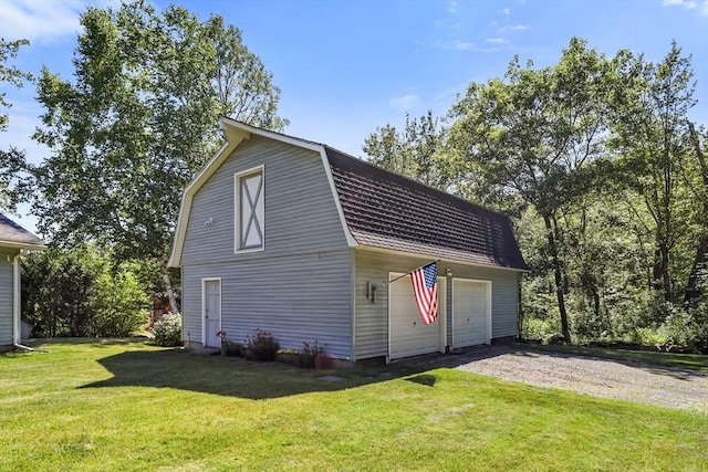 236 Ridge Ave, Otis, MA 01253 - view of home's exterior featuring a gambrel roof, an outdoor structure, a yard, and a detached garage