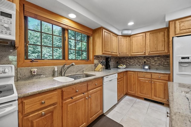 236 Ridge Ave, Otis, MA 01253 - kitchen with a sink, white appliances, light tile patterned floors, backsplash, and light stone counters