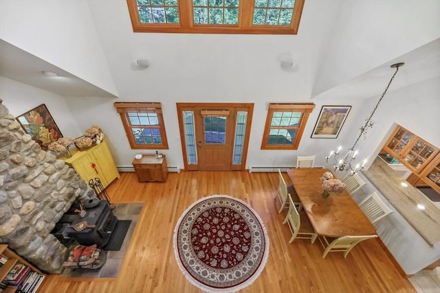 236 Ridge Ave, Otis, MA 01253 - entryway with a towering ceiling, wood finished floors, a baseboard heating unit, a chandelier, and baseboards