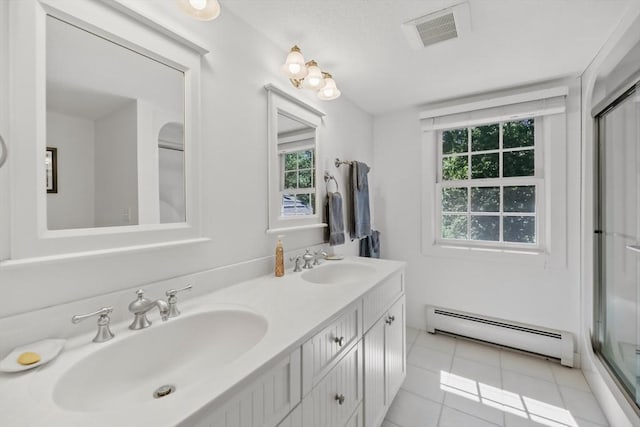 236 Ridge Ave, Otis, MA 01253 - bathroom featuring a baseboard radiator, double vanity, tile patterned flooring, and a shower with shower door