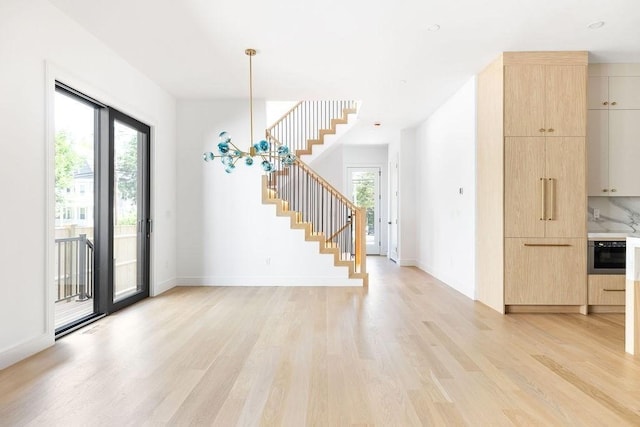 1597 Centre St Unit A, Newton, MA 02461 - entrance foyer featuring stairway, light wood-style flooring, and healthy amount of natural light
