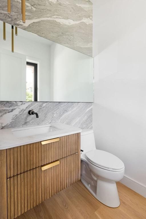 1597 Centre St Unit A, Newton, MA 02461 - half bathroom with wood finished floors and vanity