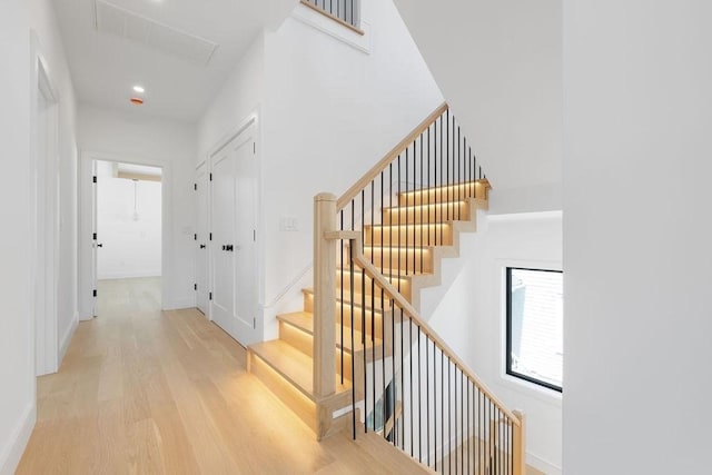 1597 Centre St Unit A, Newton, MA 02461 - stairs featuring wood finished floors and recessed lighting