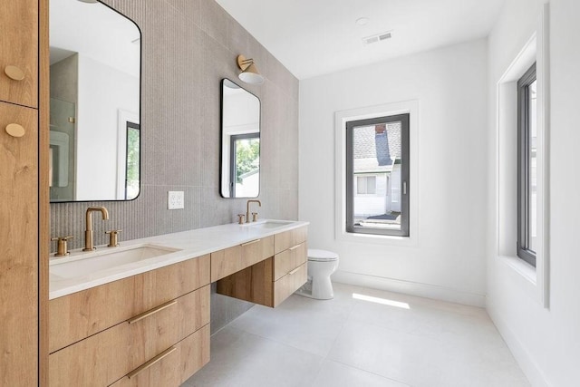 1597 Centre St Unit A, Newton, MA 02461 - bathroom with double vanity and toilet