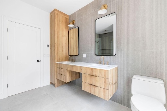 1597 Centre St Unit A, Newton, MA 02461 - bathroom featuring double vanity, a shower, and tile walls