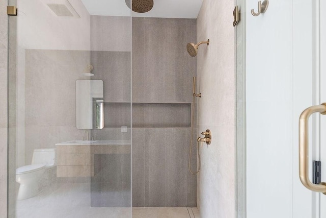 1597 Centre St Unit A, Newton, MA 02461 - bathroom featuring tile walls, tiled shower, and tile patterned floors