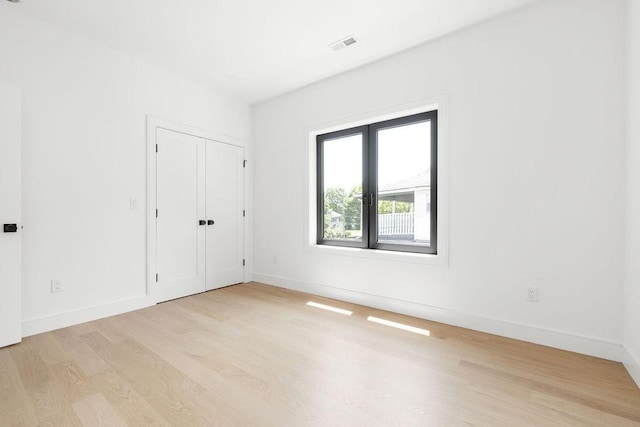 1597 Centre St Unit A, Newton, MA 02461 - unfurnished bedroom featuring light wood-type flooring and a closet