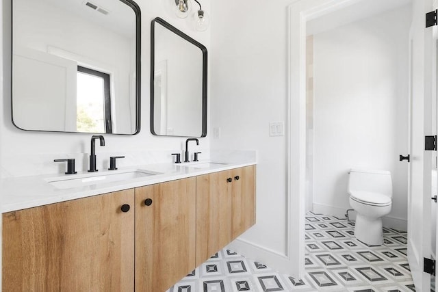 1597 Centre St Unit A, Newton, MA 02461 - full bathroom with double vanity and tile patterned floors