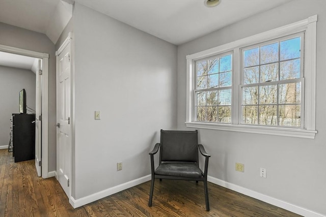 sitting room with wood finished floors, a healthy amount of sunlight, and baseboards