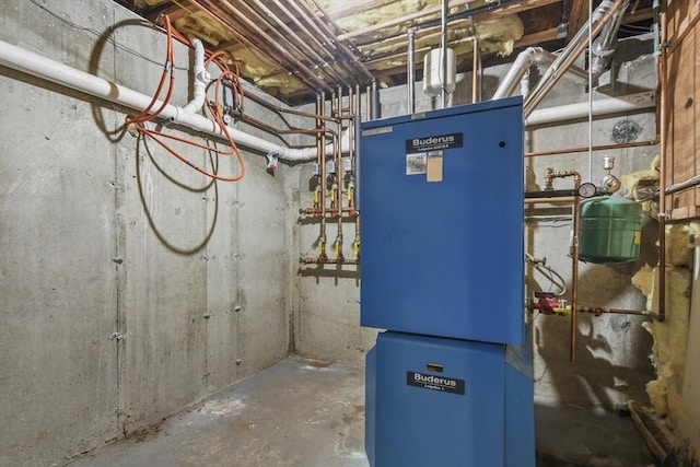 utility room featuring heating unit