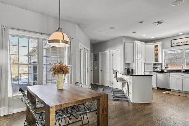 dining space with recessed lighting, visible vents, baseboards, and dark wood-style floors