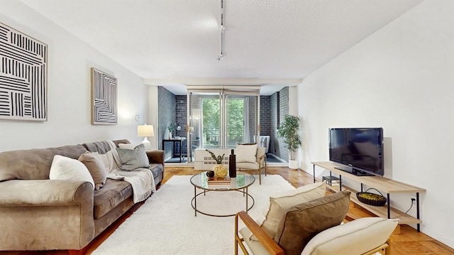 99 Pond Ave Unit 326, Brookline, MA 02445 - living area with rail lighting and baseboards