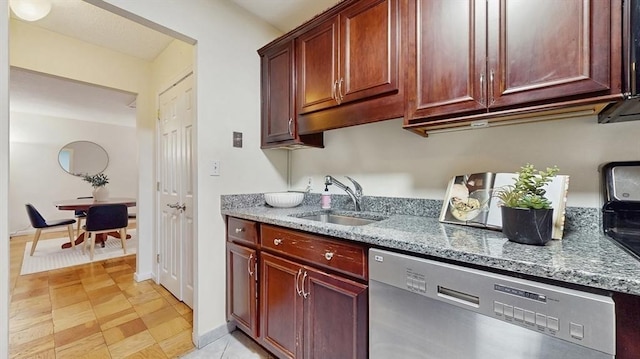 99 Pond Ave Unit 326, Brookline, MA 02445 - kitchen with stainless steel dishwasher, a sink, light stone counters, and reddish brown cabinets