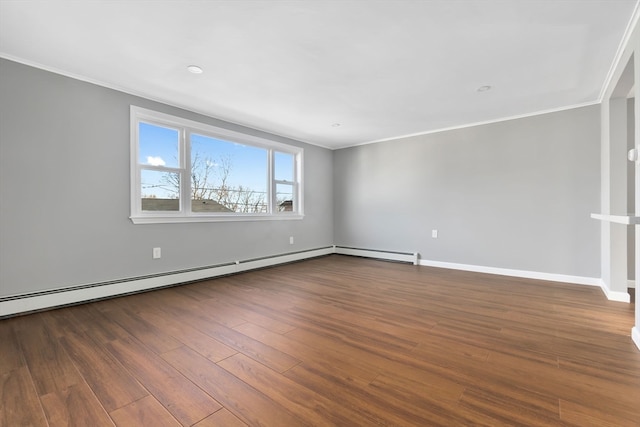 empty room featuring hardwood / wood-style floors, a baseboard radiator, and ornamental molding