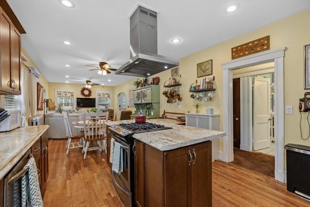 200 Woodside Ave, Winthrop, MA 02152 - kitchen with stainless steel range with gas stovetop, island range hood, ceiling fan, light wood-style flooring, and recessed lighting