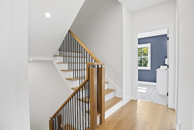 staircase featuring hardwood / wood-style flooring