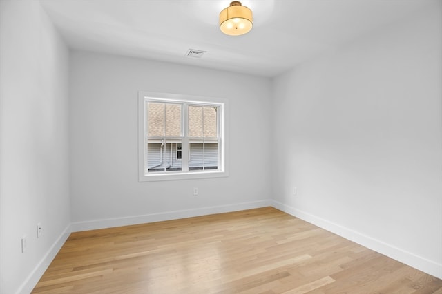 unfurnished room featuring light wood-type flooring