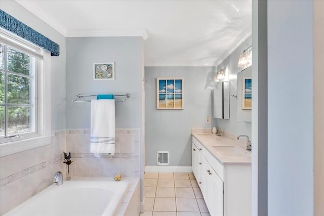 bathroom with a sink, tile patterned flooring, baseboards, visible vents, and a garden tub