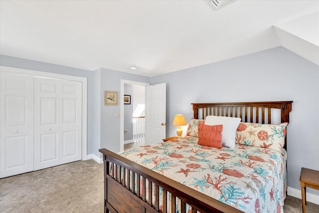 carpeted bedroom with baseboards, visible vents, and a closet