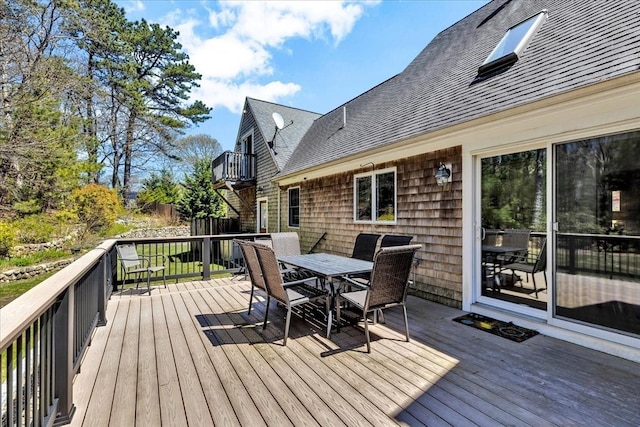 deck with outdoor dining space