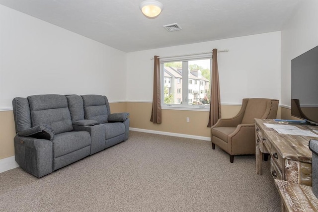 62 Maple St Unit J, Canton, MA 02021 - carpeted living room featuring baseboards