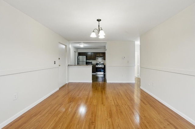 21 Central Ave Unit 30, Everett, MA 02149 - unfurnished living room featuring light wood-style flooring and a chandelier