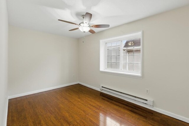 21 Central Ave Unit 30, Everett, MA 02149 - unfurnished room featuring baseboard heating, wood finished floors, and ceiling fan