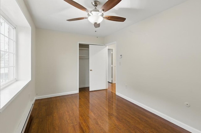 21 Central Ave Unit 30, Everett, MA 02149 - unfurnished bedroom featuring wood finished floors, multiple windows, a closet, and ceiling fan