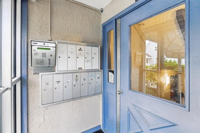 21 Central Ave Unit 30, Everett, MA 02149 - property entrance featuring stucco siding