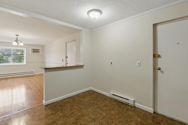 21 Central Ave Unit 30, Everett, MA 02149 - empty room with a baseboard heating unit, a chandelier, a textured ceiling, ornamental molding, and an AC wall unit