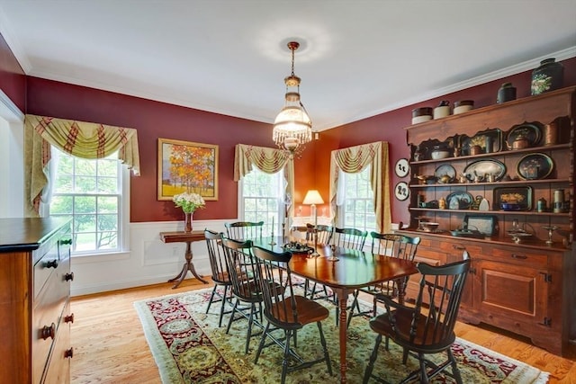 43 Old Concord Rd, Lincoln, MA 01773 - dining room with light wood finished floors, wainscoting, crown molding, and a chandelier