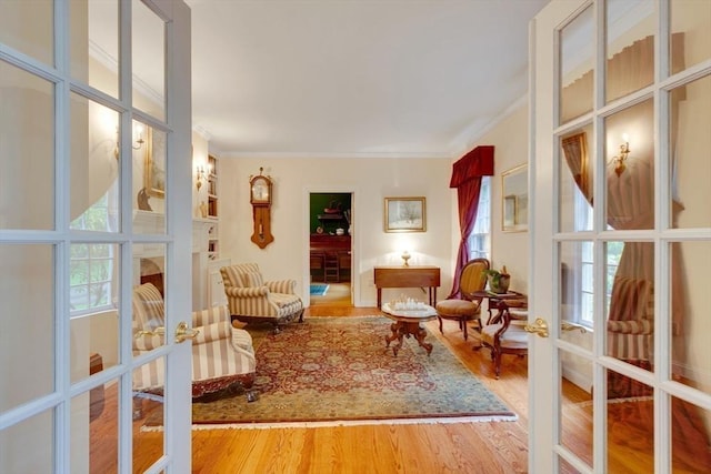 43 Old Concord Rd, Lincoln, MA 01773 - sitting room with french doors, ornamental molding, and wood finished floors