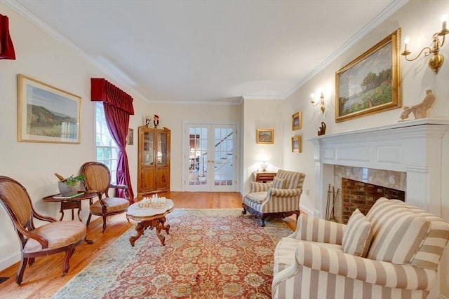 43 Old Concord Rd, Lincoln, MA 01773 - sitting room with wood finished floors, ornamental molding, french doors, and baseboards