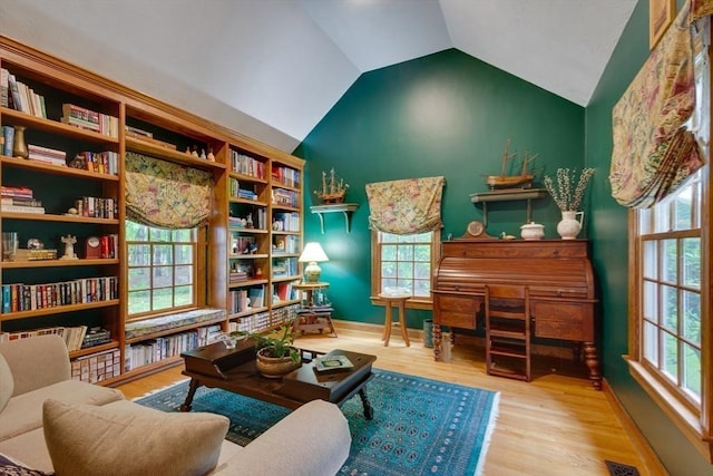 43 Old Concord Rd, Lincoln, MA 01773 - living area featuring vaulted ceiling, wood finished floors, and baseboards