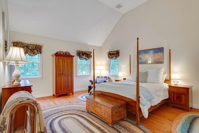 43 Old Concord Rd, Lincoln, MA 01773 - bedroom featuring light wood-style flooring, multiple windows, vaulted ceiling, and baseboards