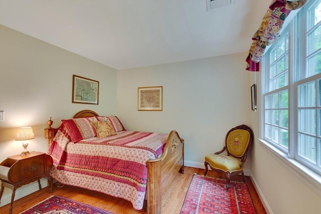 43 Old Concord Rd, Lincoln, MA 01773 - bedroom with multiple windows, wood finished floors, and baseboards