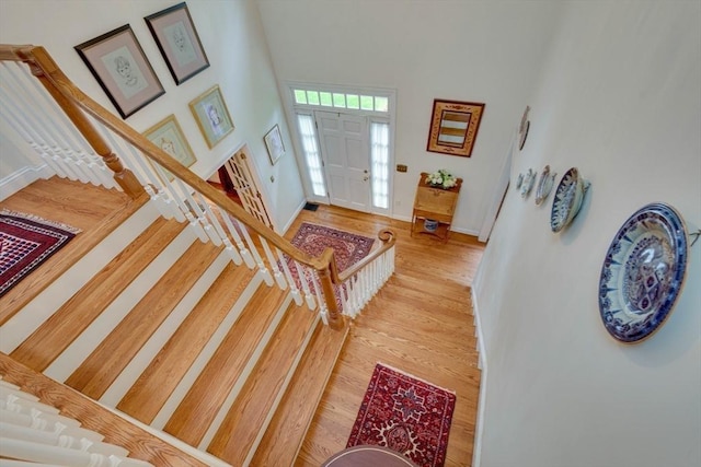 43 Old Concord Rd, Lincoln, MA 01773 - entrance foyer featuring stairway, wood finished floors, baseboards, and a towering ceiling