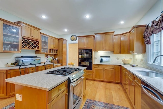 43 Old Concord Rd, Lincoln, MA 01773 - kitchen featuring stainless steel appliances, a sink, light wood-style flooring, light countertops, and recessed lighting