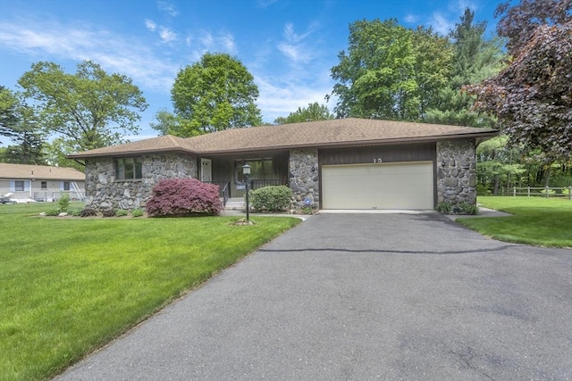 ranch-style house with stone siding, an attached garage, driveway, and covered porch
