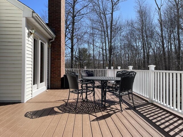 wooden deck with outdoor dining area