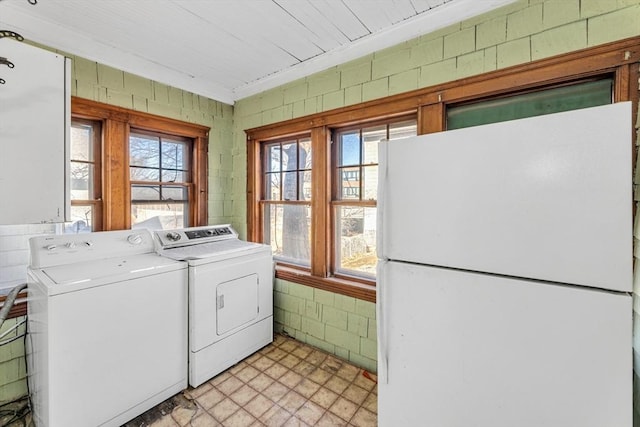 washroom with washer and dryer