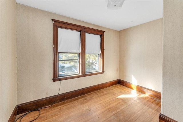 unfurnished room featuring hardwood / wood-style floors