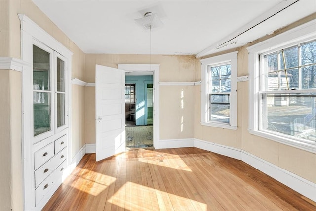 spare room with light wood-type flooring