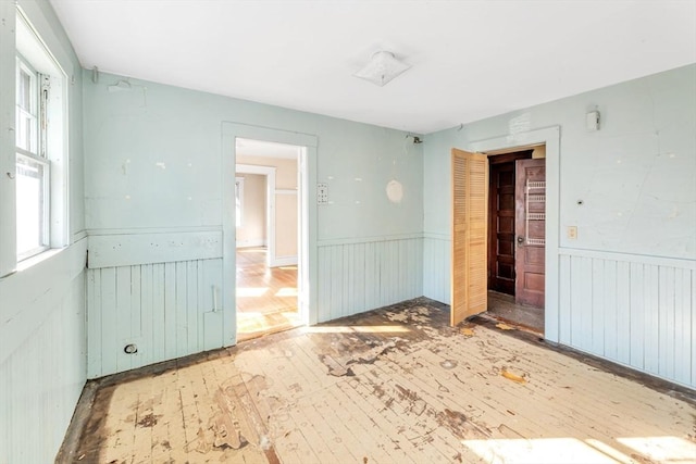 empty room with hardwood / wood-style flooring