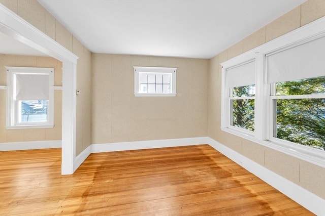 unfurnished room with light hardwood / wood-style floors