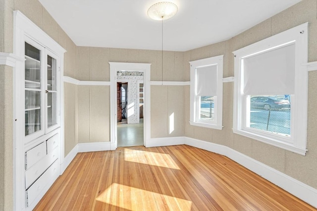 unfurnished dining area featuring hardwood / wood-style flooring