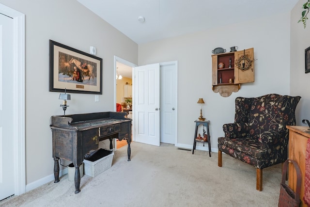 sitting room with light colored carpet